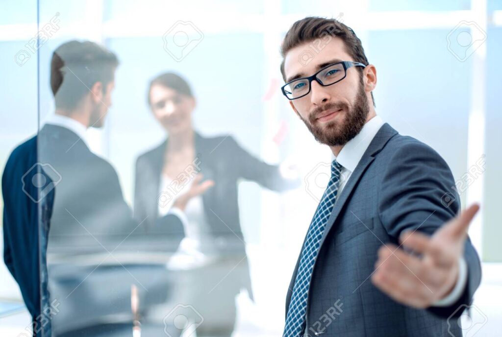 successful businessman inviting to his office.concept of partnership